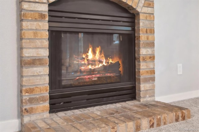 room details featuring a brick fireplace