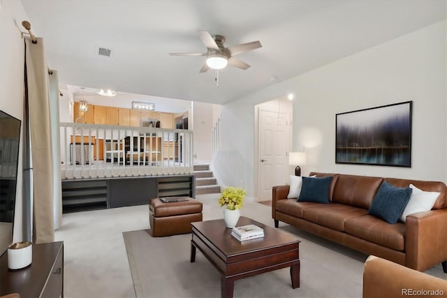 living room with light carpet and ceiling fan