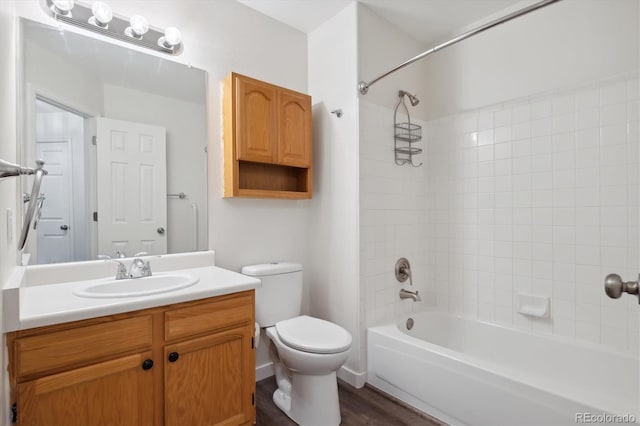 full bathroom with vanity, toilet, and tiled shower / bath combo