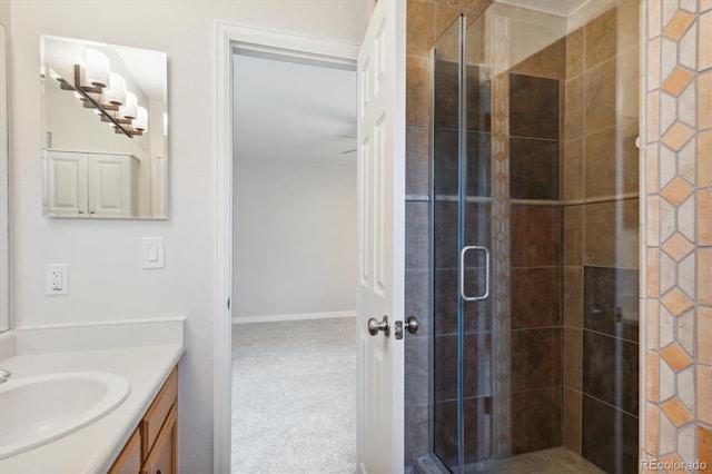 bathroom featuring vanity and an enclosed shower