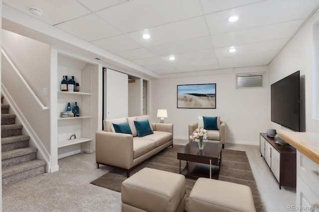 carpeted living room featuring built in shelves