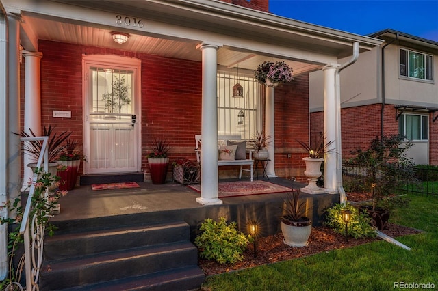 3016 N Franklin St, Denver, CO 80205 - property entrance featuring a porch and brick siding