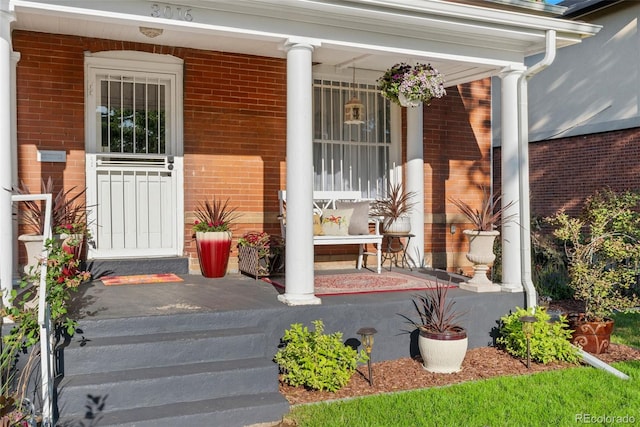 3016 N Franklin St, Denver, CO 80205 - view of exterior entry with covered porch and brick siding