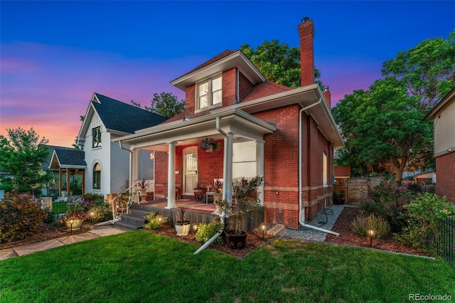 3016 N Franklin St, Denver, CO 80205 - view of front of property featuring covered porch, a chimney, and brick siding