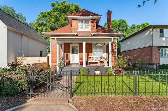 3016 N Franklin St, Denver, CO 80205 - view of front of property with covered porch, brick siding, a fenced front yard, a chimney, and a gate