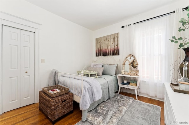 3016 N Franklin St, Denver, CO 80205 - bedroom featuring wood finished floors and a closet