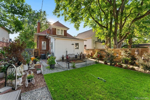 3016 N Franklin St, Denver, CO 80205 - rear view of house with a fenced backyard, a patio, a chimney, and stucco siding