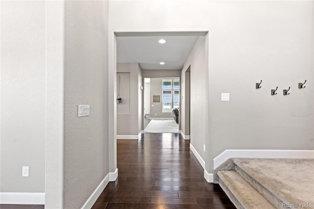 hall with dark hardwood / wood-style floors