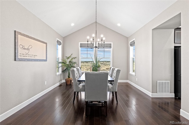 dining room featuring a healthy amount of sunlight, a chandelier, and dark wood-type flooring