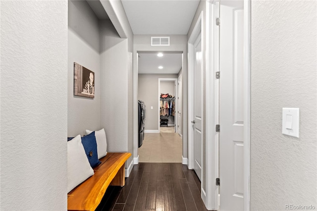 corridor featuring dark wood-type flooring