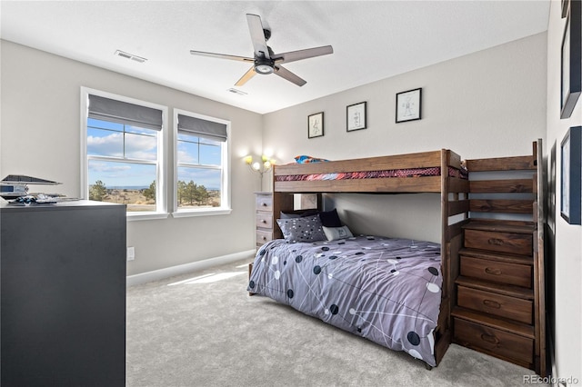 bedroom with light colored carpet and ceiling fan