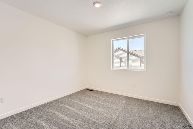 1232-1234 S Algonquian, Aurora, CO 80018 - carpeted empty room featuring baseboards and a smoke detector