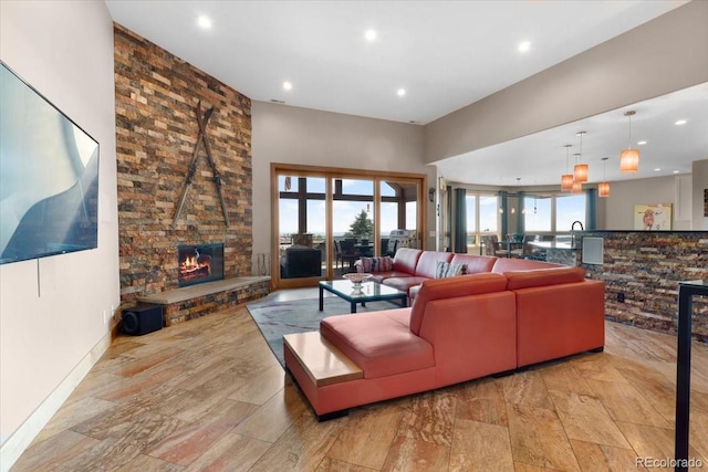6170 Falcon Ridge Ln, Morrison, CO 80465 - living area with recessed lighting and a stone fireplace