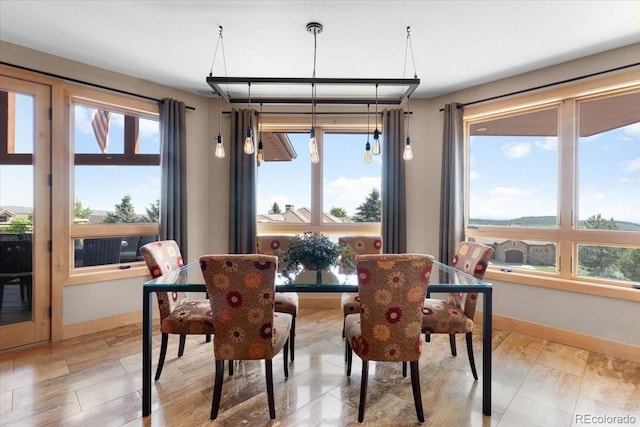 6170 Falcon Ridge Ln, Morrison, CO 80465 - dining room with healthy amount of natural light