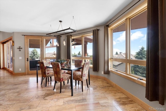 6170 Falcon Ridge Ln, Morrison, CO 80465 - dining space with baseboards
