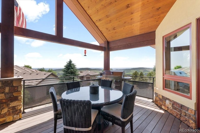 6170 Falcon Ridge Ln, Morrison, CO 80465 - wooden terrace with outdoor dining area
