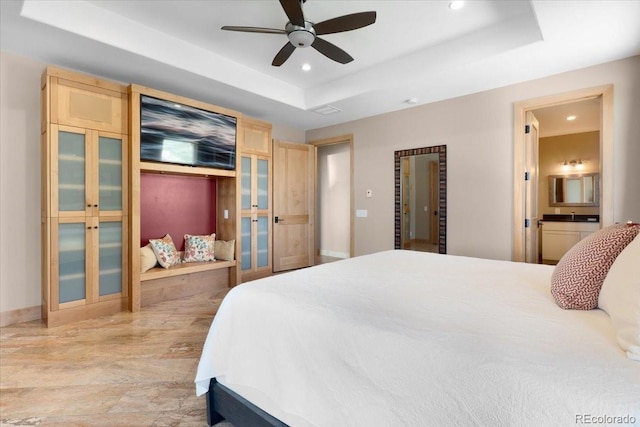 6170 Falcon Ridge Ln, Morrison, CO 80465 - bedroom featuring a tray ceiling, recessed lighting, a ceiling fan, and ensuite bath