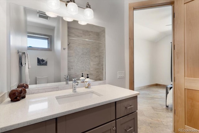 6170 Falcon Ridge Ln, Morrison, CO 80465 - full bath featuring vanity and a tile shower