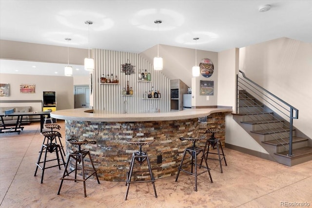 6170 Falcon Ridge Ln, Morrison, CO 80465 - bar featuring stairway, hanging light fixtures, and refrigerator