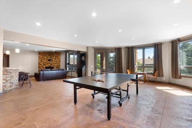 6170 Falcon Ridge Ln, Morrison, CO 80465 - game room featuring finished concrete flooring, recessed lighting, and a fireplace