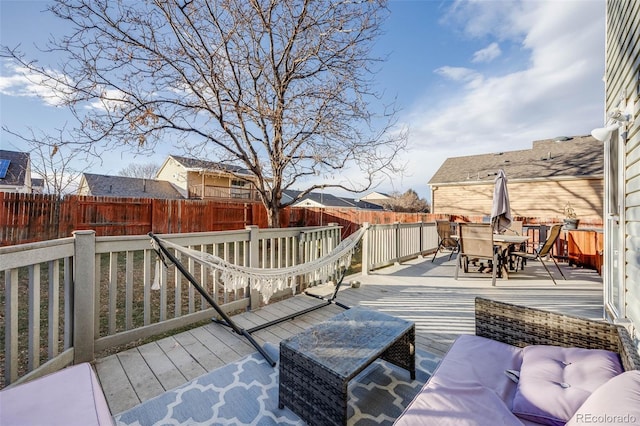 wooden terrace featuring an outdoor living space