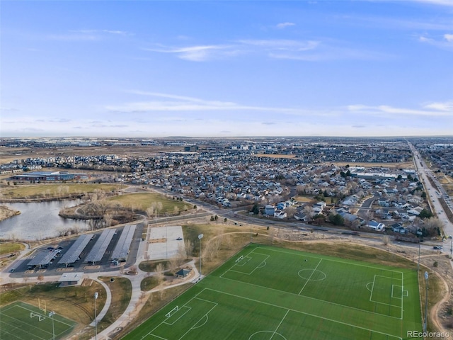 birds eye view of property featuring a water view