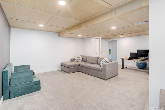 carpeted living area featuring baseboards and recessed lighting
