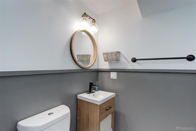 bathroom with toilet and vanity