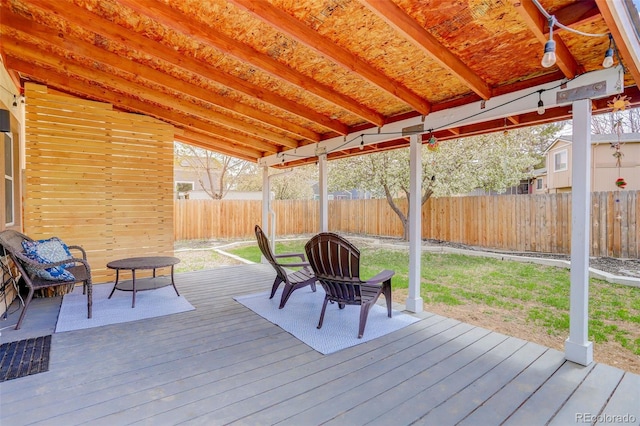 wooden deck featuring a fenced backyard
