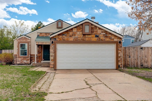 view of front of house featuring stone siding, driveway, an attached garage, and stucco siding