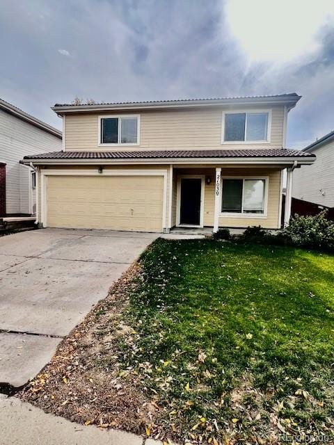 view of front property with a garage and a front lawn