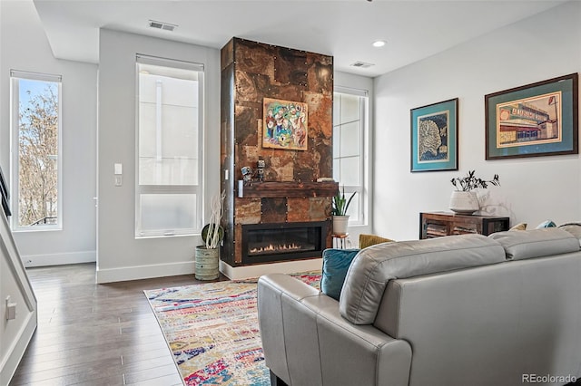 3444 Navajo St Unit 10, Denver, CO 80211 - living room with wood finished floors, baseboards, a large fireplace, and recessed lighting