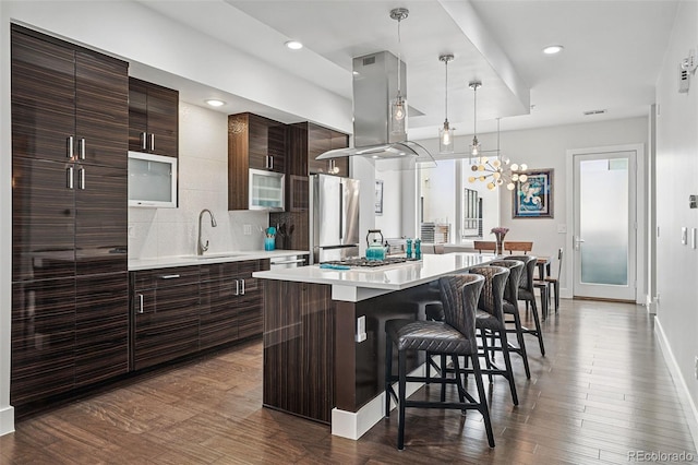 3444 Navajo St Unit 10, Denver, CO 80211 - kitchen featuring freestanding refrigerator, a sink, island range hood, modern cabinets, and recessed lighting