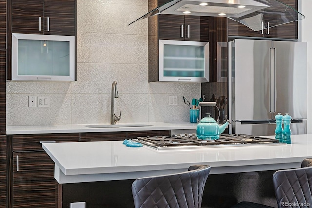 3444 Navajo St Unit 10, Denver, CO 80211 - kitchen with appliances with stainless steel finishes, a sink, modern cabinets, glass insert cabinets, and tasteful backsplash