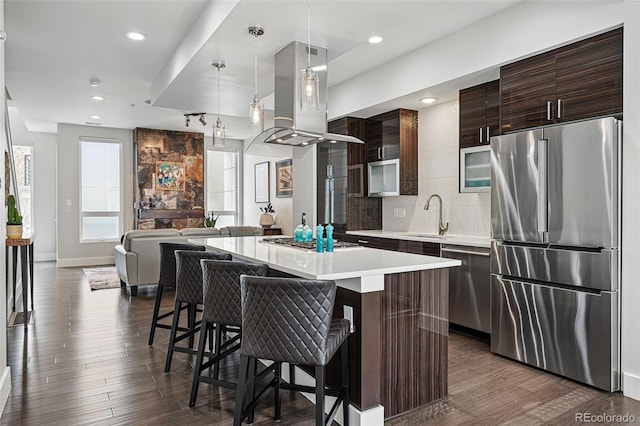 3444 Navajo St Unit 10, Denver, CO 80211 - kitchen featuring stainless steel appliances, modern cabinets, a sink, island range hood, and light countertops