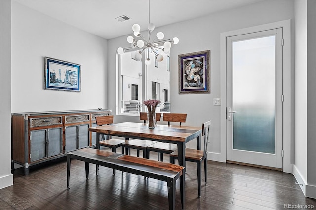 3444 Navajo St Unit 10, Denver, CO 80211 - dining room featuring a chandelier, dark wood-type flooring, and baseboards