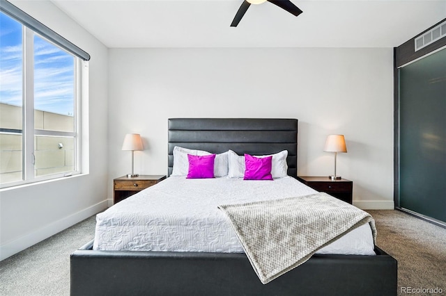 3444 Navajo St Unit 10, Denver, CO 80211 - carpeted bedroom with multiple windows, baseboards, and ceiling fan