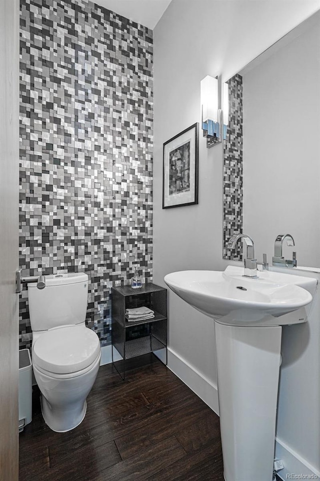 3444 Navajo St Unit 10, Denver, CO 80211 - bathroom with wood finished floors, toilet, and baseboards