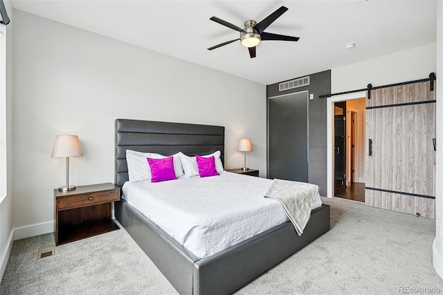 3444 Navajo St Unit 10, Denver, CO 80211 - carpeted bedroom featuring a barn door and ceiling fan