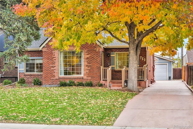 view of front of property with a front yard and a garage