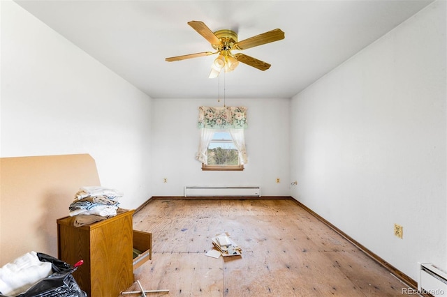 unfurnished room with baseboard heating, ceiling fan, wood finished floors, and baseboards