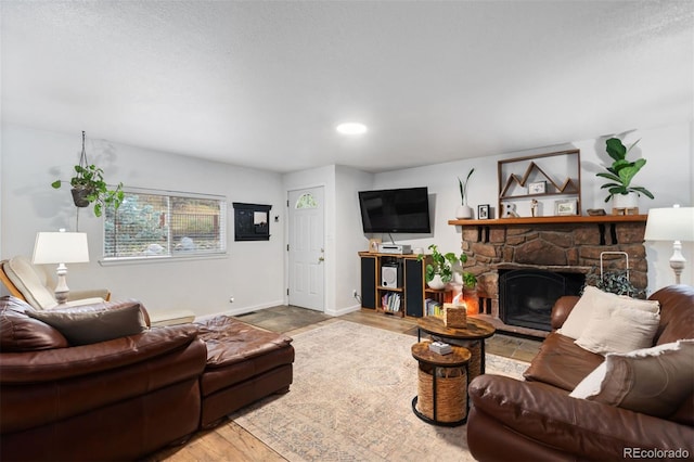 26095 Columbine Trl, Kittredge, CO 80457 - living area with baseboards, a fireplace, wood finished floors, and recessed lighting