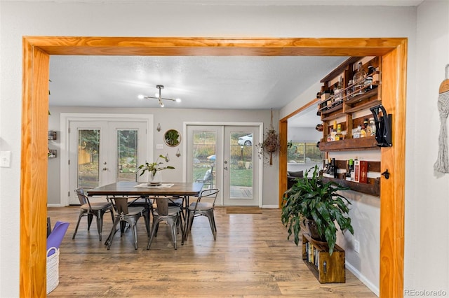 26095 Columbine Trl, Kittredge, CO 80457 - dining area with baseboards, wood finished floors, and french doors