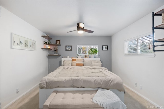 26095 Columbine Trl, Kittredge, CO 80457 - carpeted bedroom with multiple windows, ceiling fan, and baseboards