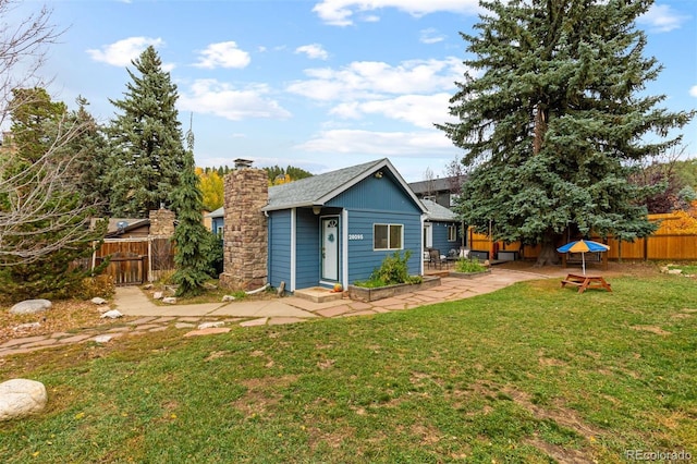 26095 Columbine Trl, Kittredge, CO 80457 - rear view of property with a patio area, fence, and a lawn