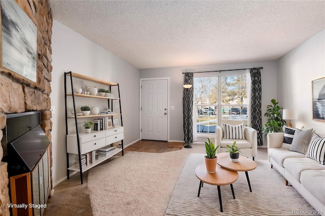 living room with carpet flooring and a textured ceiling