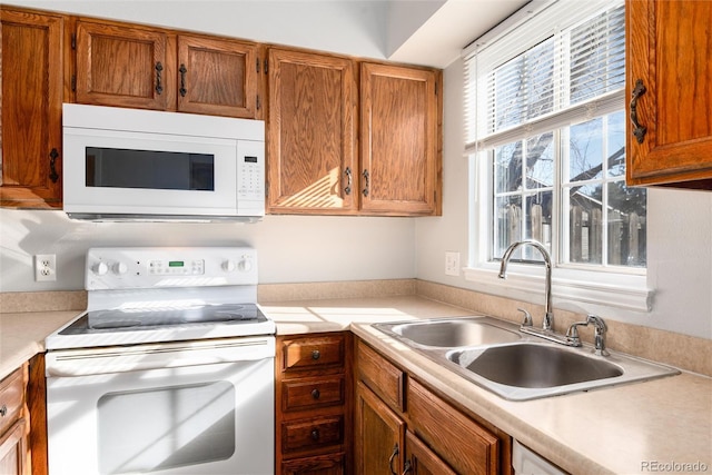 kitchen with sink and white appliances