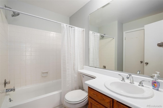 full bathroom featuring shower / bathtub combination with curtain, vanity, and toilet