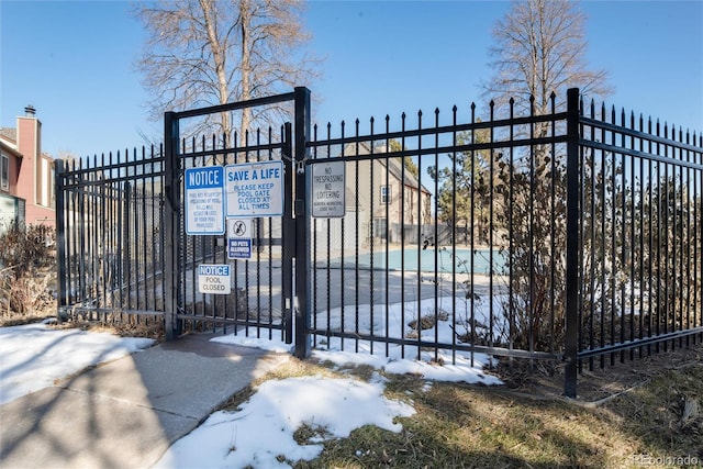 view of snow covered gate