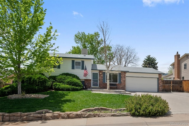 4525 S Cole Ct, Morrison, CO 80465 - tri-level home featuring concrete driveway, a garage, and brick siding